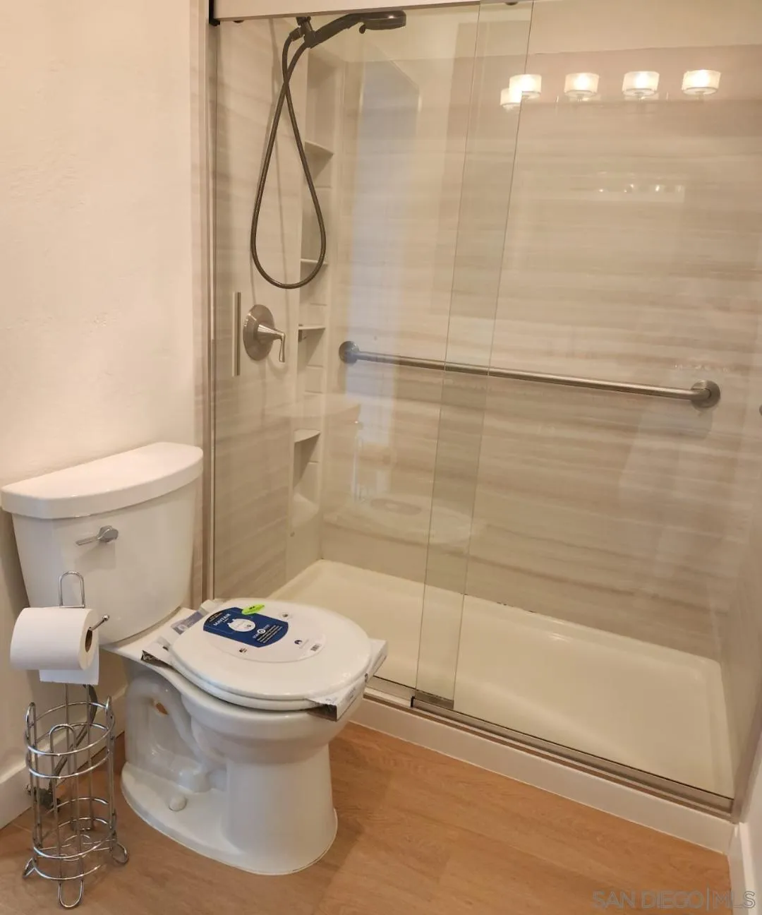 230 Prospect Street, Unit 33 La Jolla, CA 92037 - Photo 15 of 27 a bathroom with a toilet and a shower