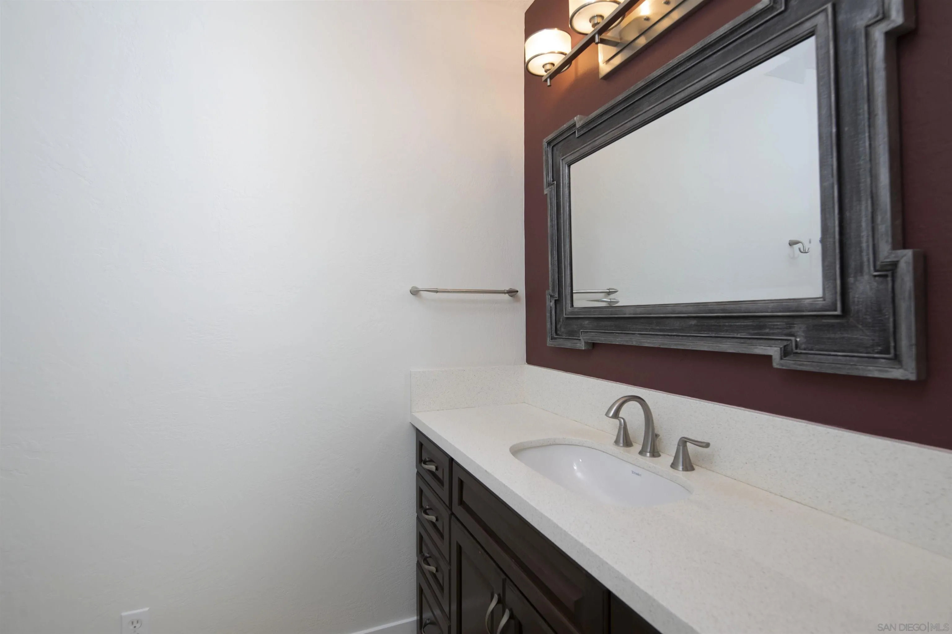 230 Prospect Street, Unit 33 La Jolla, CA 92037 - Photo 16 of 27 a bathroom with a sink and a mirror