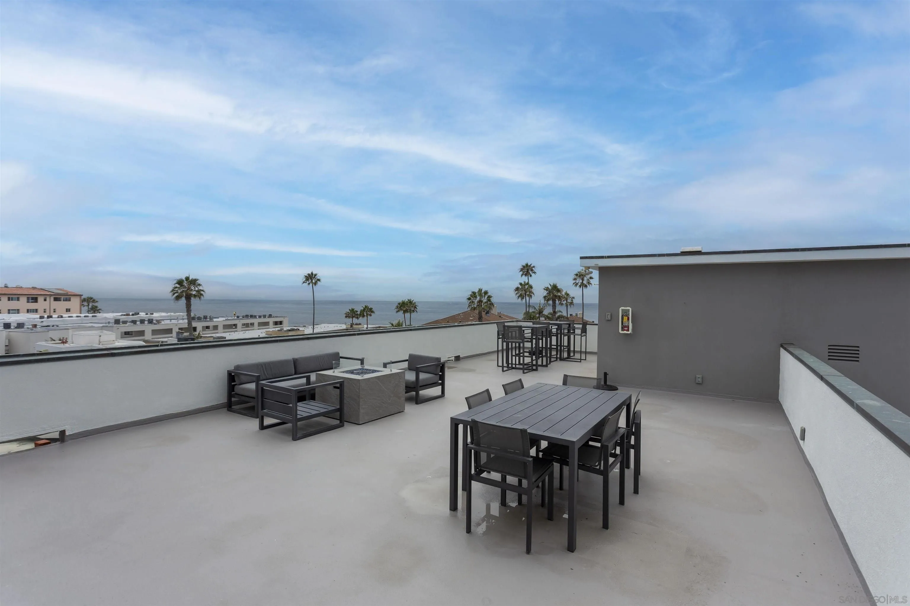 230 Prospect Street, Unit 33 La Jolla, CA 92037 - Photo 24 of 27 a terrace with a table and chairs