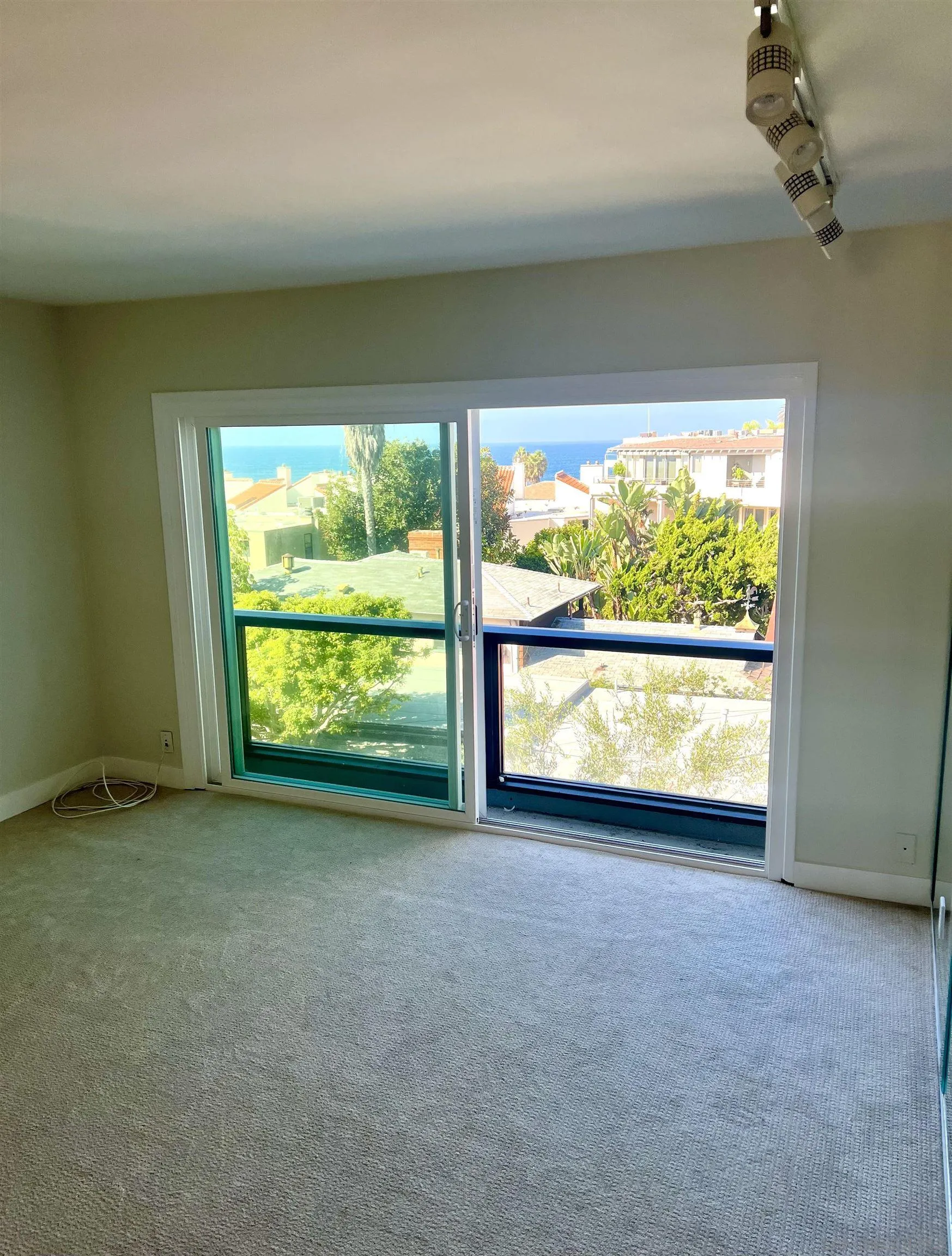230 Prospect Street, Unit 33 La Jolla, CA 92037 - Photo 9 of 27 a view of an empty room with a window