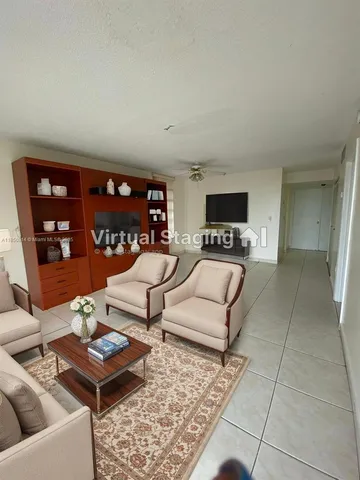 a bedroom with a large bed and a couch