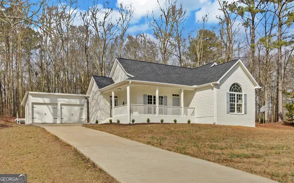a view of house with yard