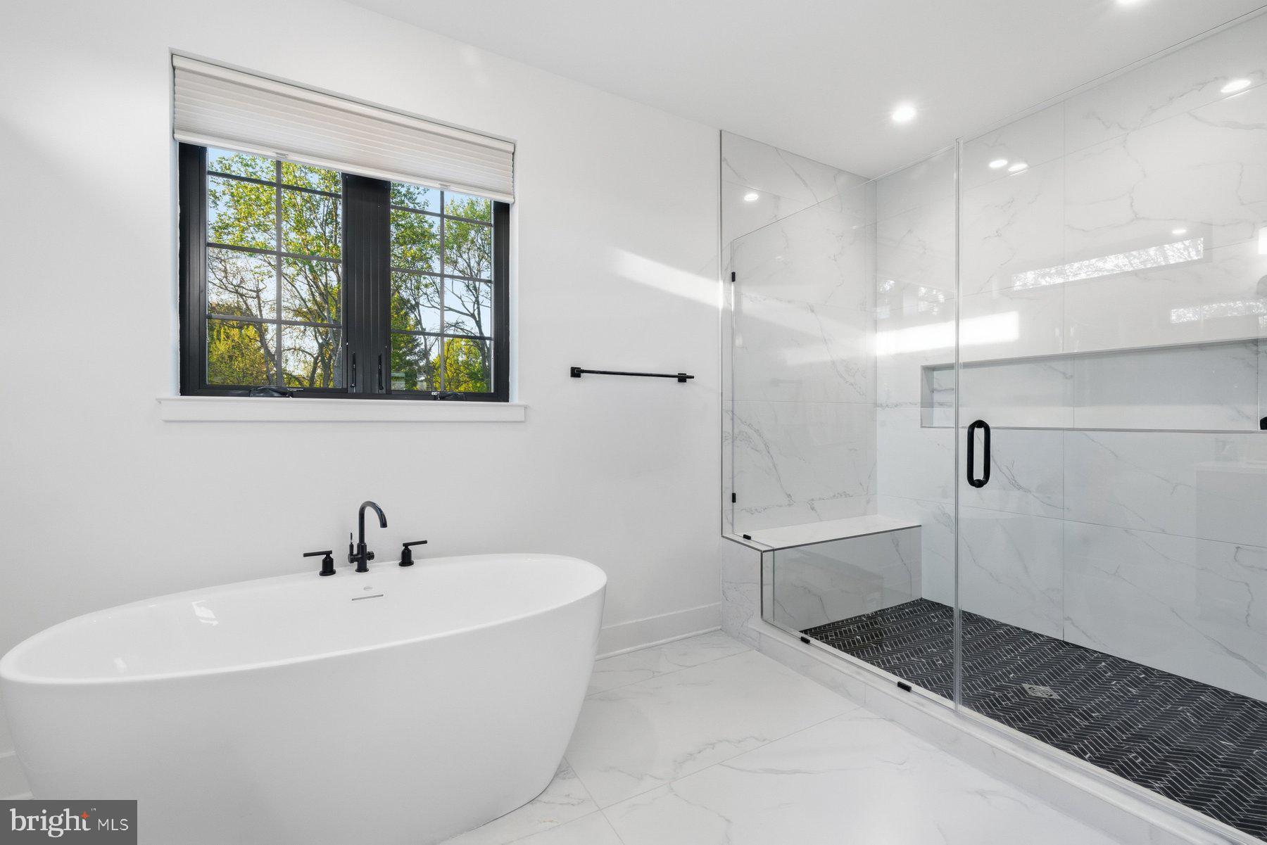 13823 Brighton Dam Road Clarksville, MD 21029 - Photo 24 of 35 a white bath tub sitting in a bathroom