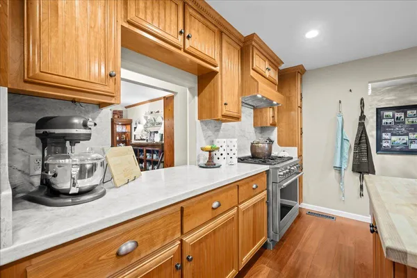a kitchen with stainless steel appliances granite countertop a sink and cabinets