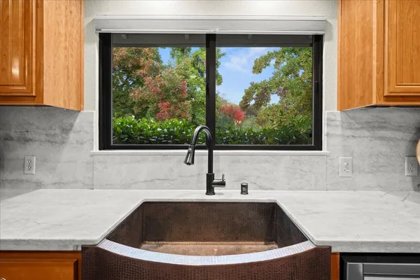 a bathroom with a bathtub and window