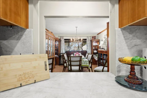 a view of a dining room with furniture and window