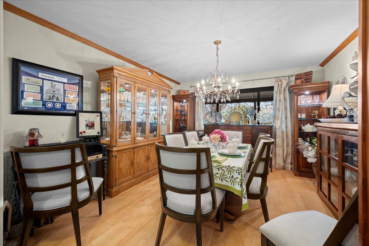 3900 Loma Drive Shingle Springs, CA 95682 - Photo 21 of 55 a view of a dining room with furniture and chandelier