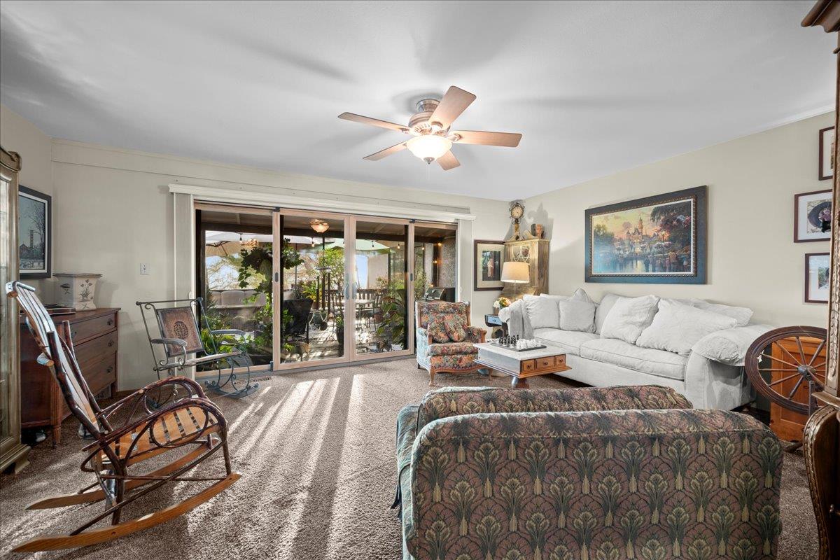 3900 Loma Drive Shingle Springs, CA 95682 - Photo 29 of 55 a living room with furniture a flat screen tv and a large window