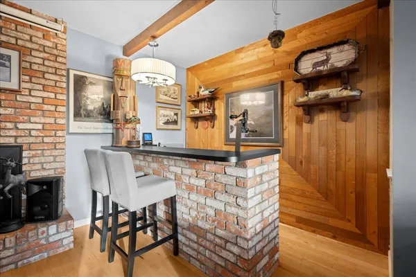 a front view of a house with a wooden floor and a sink