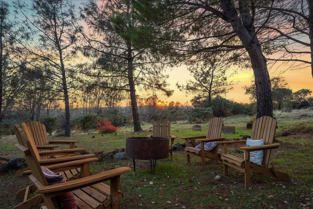a view of a patio with chairs and a table