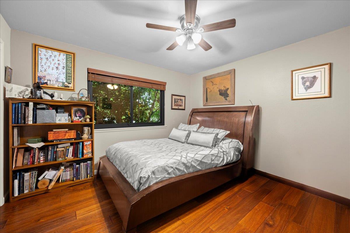3900 Loma Drive Shingle Springs, CA 95682 - Photo 35 of 55 a bed sitting in a bedroom next to a book shelf