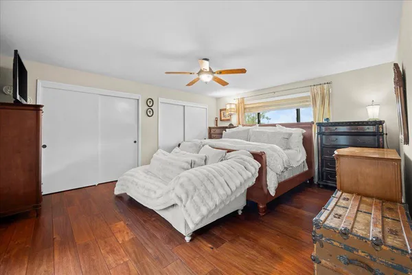 a bedroom with bed and a couch