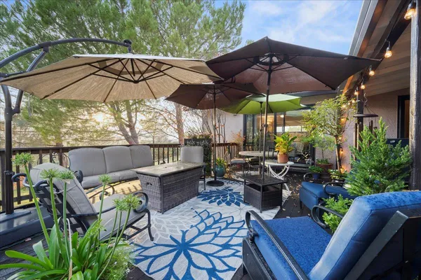 a view of a patio with furniture and yard