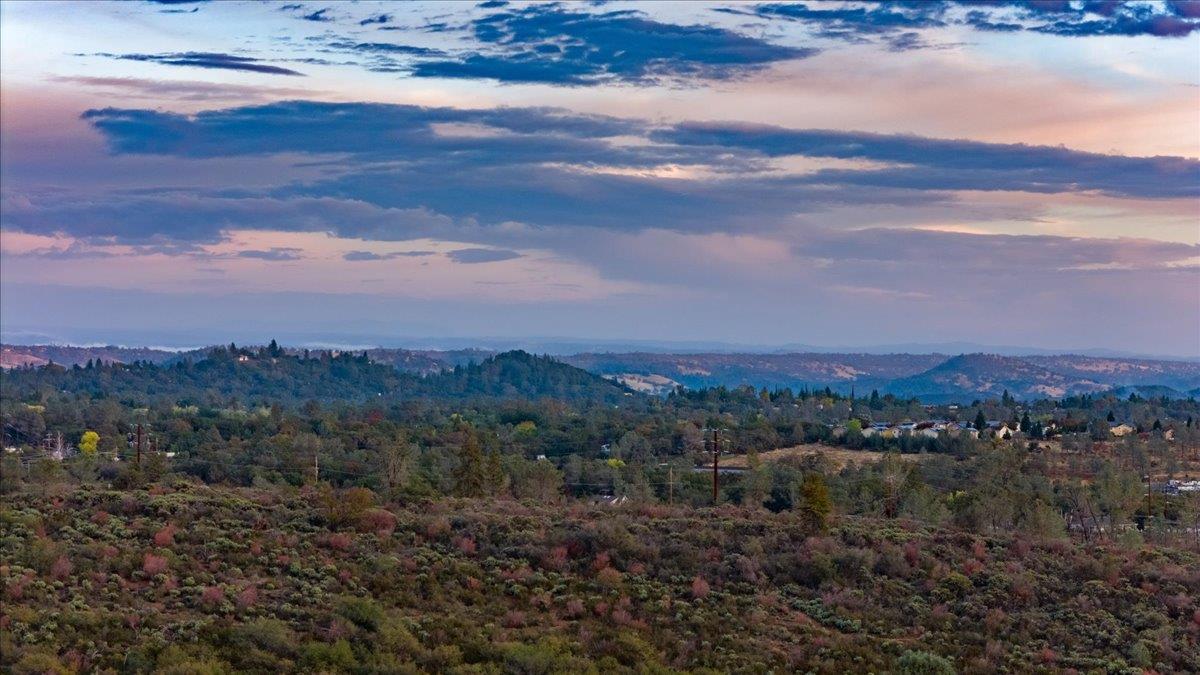 3900 Loma Drive Shingle Springs, CA 95682 - Photo 50 of 55 a view of a lake with mountains in the background