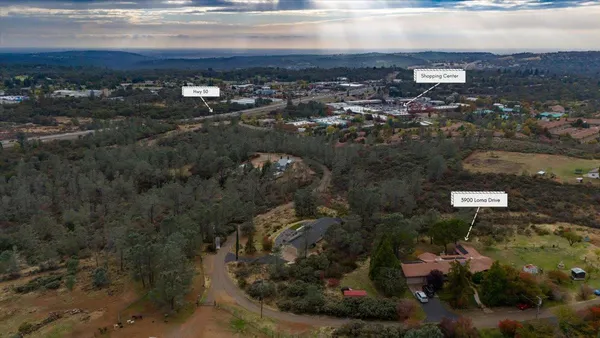 an aerial view of residential building with parking space