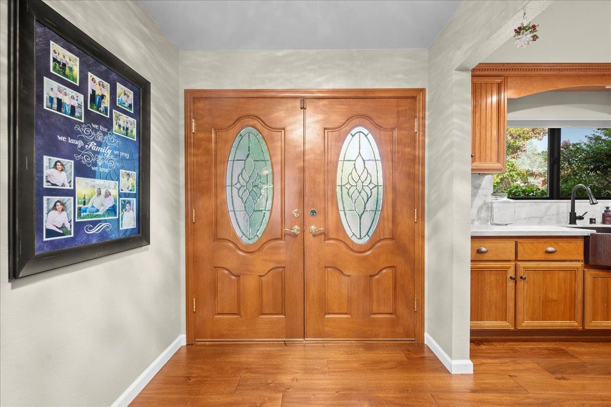 3900 Loma Drive Shingle Springs, CA 95682 - Photo 8 of 55 a view of a door with a fireplace and a potted plant