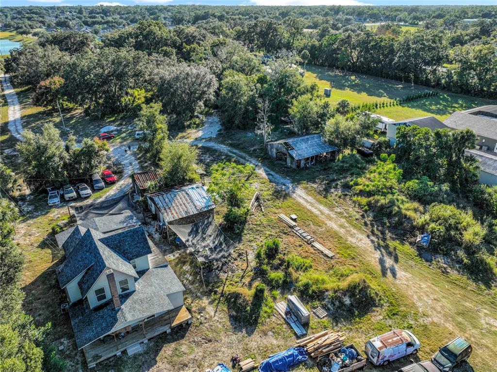 7717 Clarcona Ocoee Road, Unit LOT 1 Orlando, FL 32818 - Photo 11 of 36 an aerial view of residential house with outdoor space