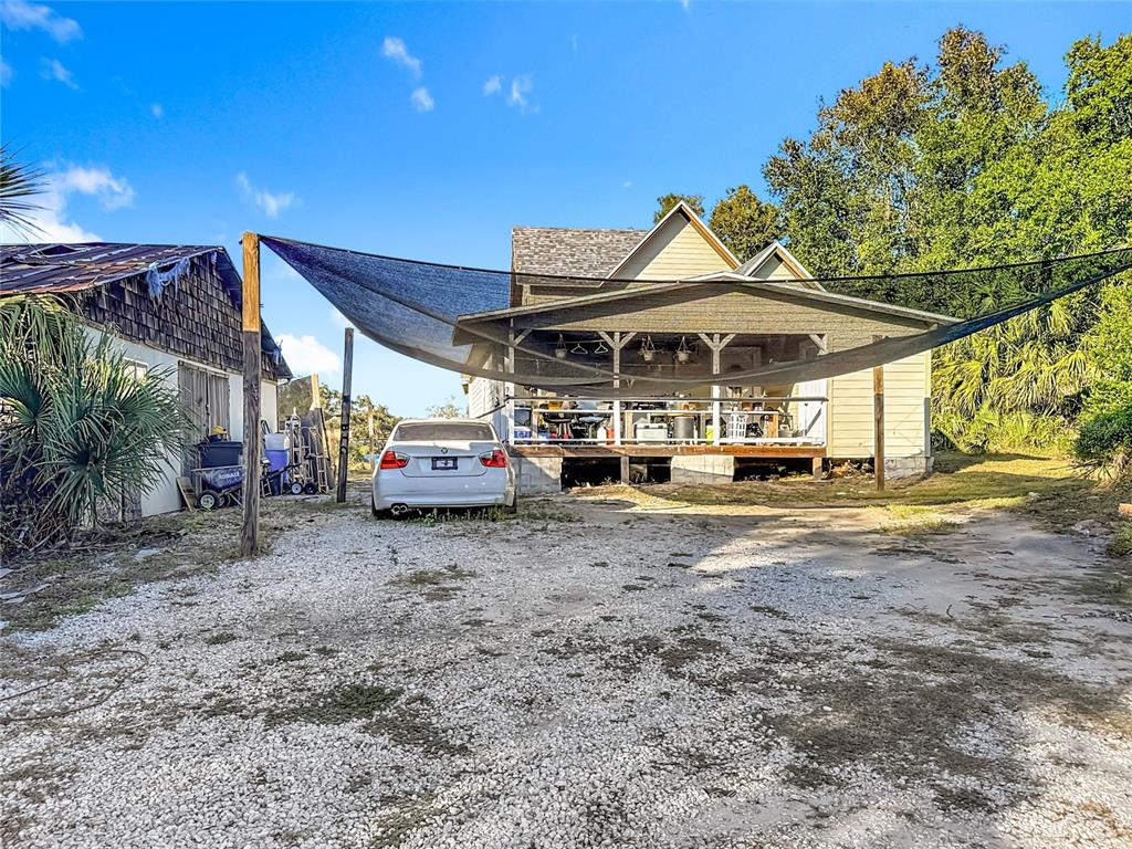 7717 Clarcona Ocoee Road, Unit LOT 1 Orlando, FL 32818 - Photo 2 of 36 a view of a couches and table in the patio