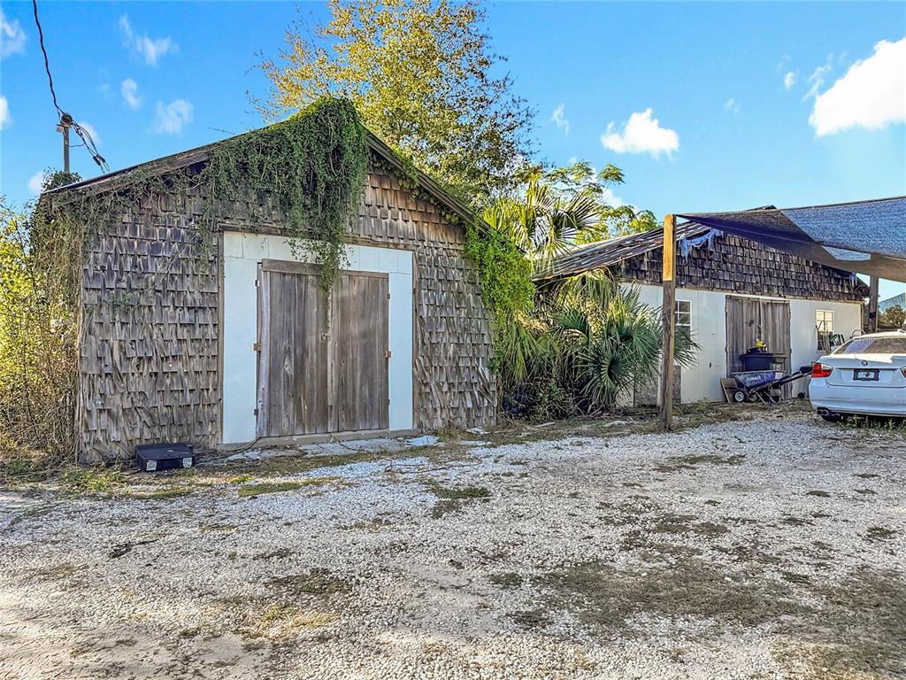 7717 Clarcona Ocoee Road, Unit LOT 1 Orlando, FL 32818 - Photo 32 of 36 a front view of a house with a yard