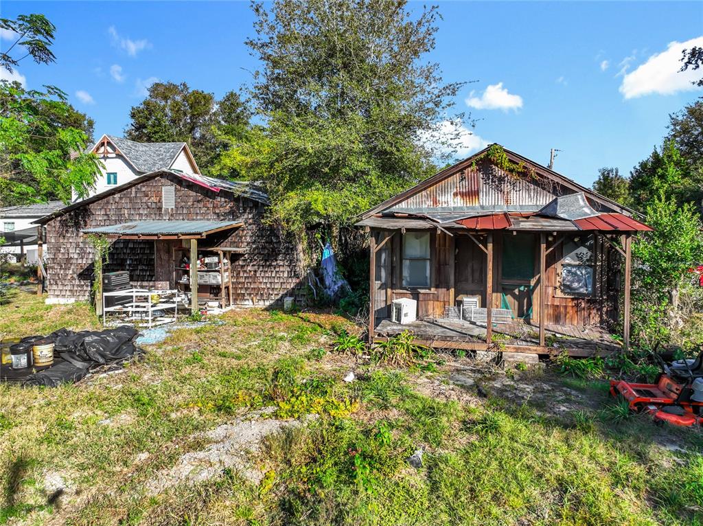 7717 Clarcona Ocoee Road, Unit LOT 1 Orlando, FL 32818 - Photo 33 of 36 a front view of a house with garden