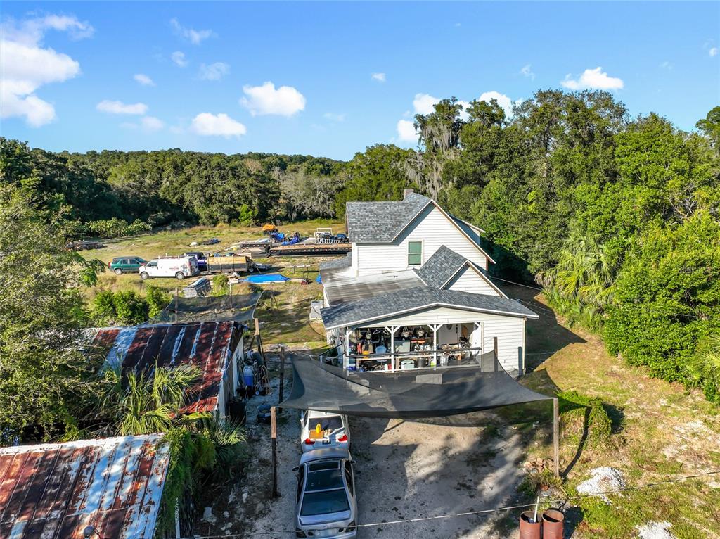 7717 Clarcona Ocoee Road, Unit LOT 1 Orlando, FL 32818 - Photo 34 of 36 a view of a house with a yard