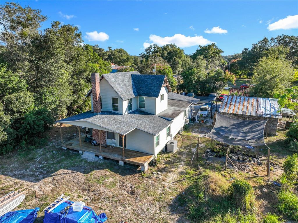 7717 Clarcona Ocoee Road, Unit LOT 1 Orlando, FL 32818 - Photo 35 of 36 a house view with a sitting space garden and outdoor seating