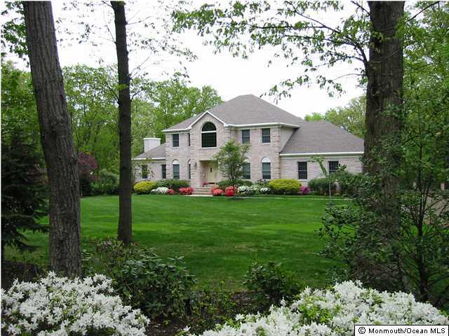 272 Portland Road Middletown, NJ 07716 - Photo 1 of 3 a front view of a house with a garden