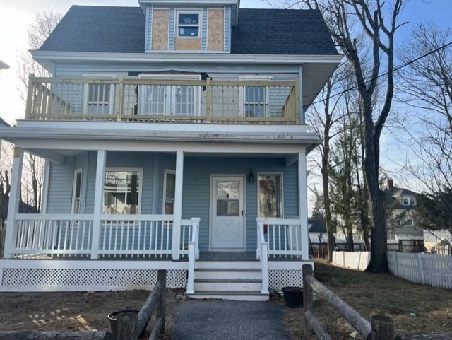 28 Kendall Street Lawrence, MA 01841 - Photo 3 of 7 front view of a house with a deck
