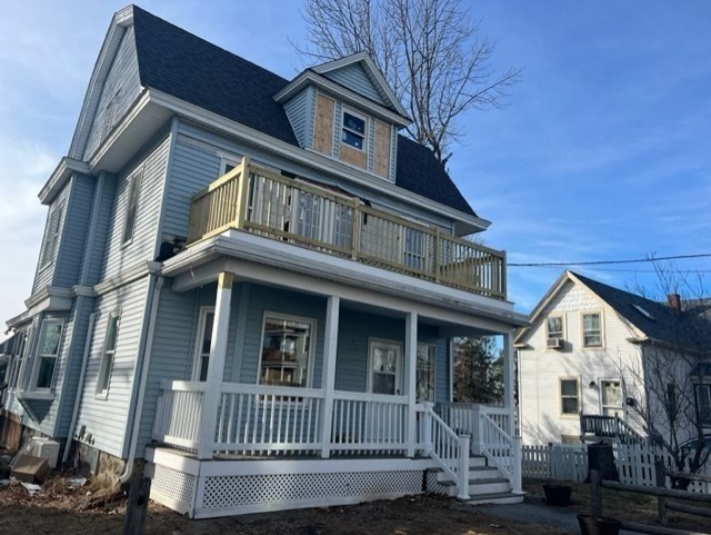 28 Kendall Street Lawrence, MA 01841 - Photo 4 of 7 a view of a white house with large windows