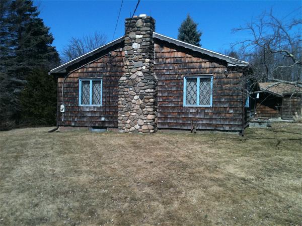 1784 Main Road Granville, MA 01034 - Photo 3 of 14 a front view of a house with a yard