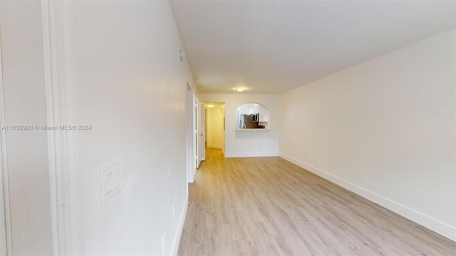 2921 Southeast 13th Road, Unit 10539 Homestead, FL 33035 - Photo 6 of 14 a view of empty room with wooden floor