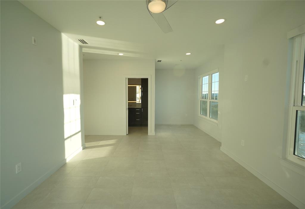 5000 Culbreath Key Way, Unit 9326 Tampa, FL 33611 - Photo 13 of 35 an empty room with windows and closet