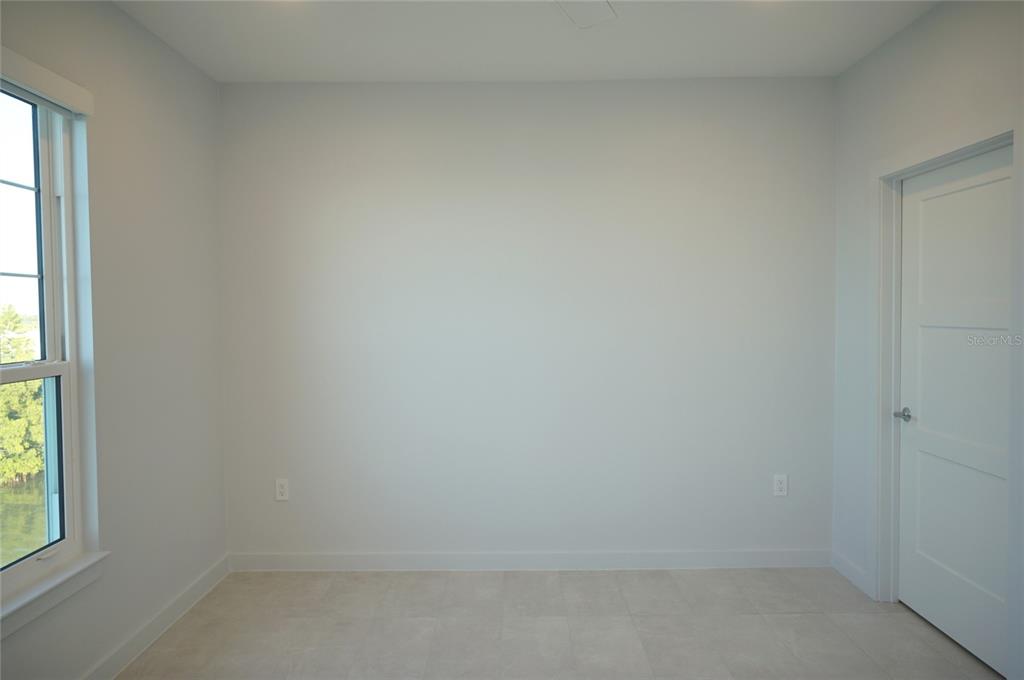 5000 Culbreath Key Way, Unit 9326 Tampa, FL 33611 - Photo 16 of 35 a view of an empty room and window