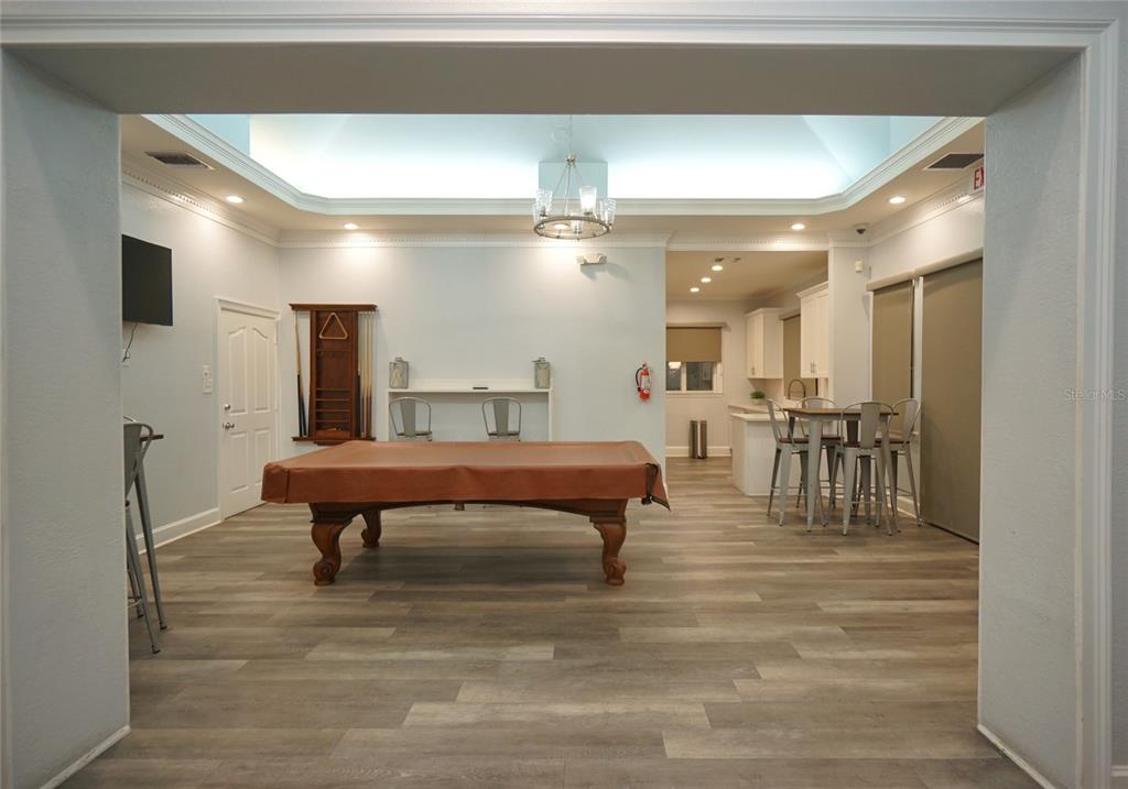 5000 Culbreath Key Way, Unit 9326 Tampa, FL 33611 - Photo 26 of 35 a room with lots of furniture and a view of kitchen