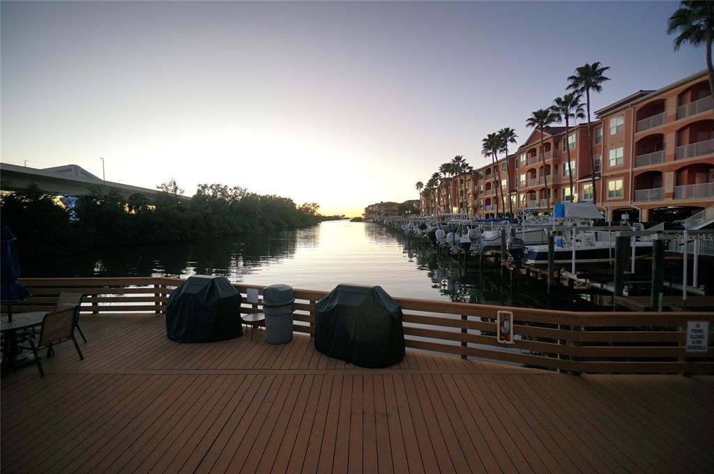 5000 Culbreath Key Way, Unit 9326 Tampa, FL 33611 - Photo 34 of 35 a balcony with wooden floor table and chairs