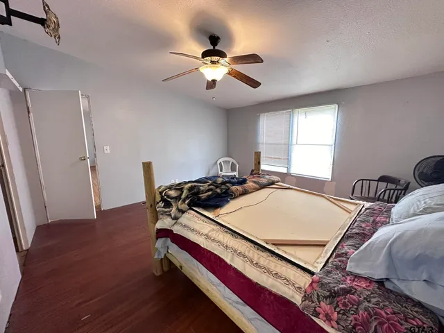 a room with a bed and a chandelier