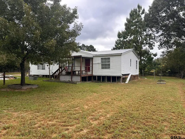 a view of a house with a swimming pool