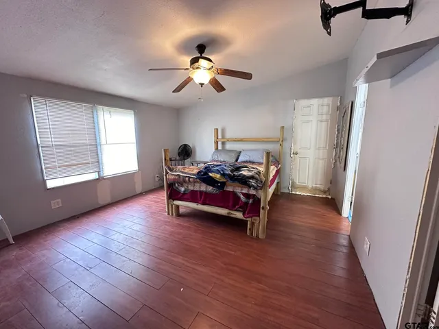 a bed room with furniture and a window