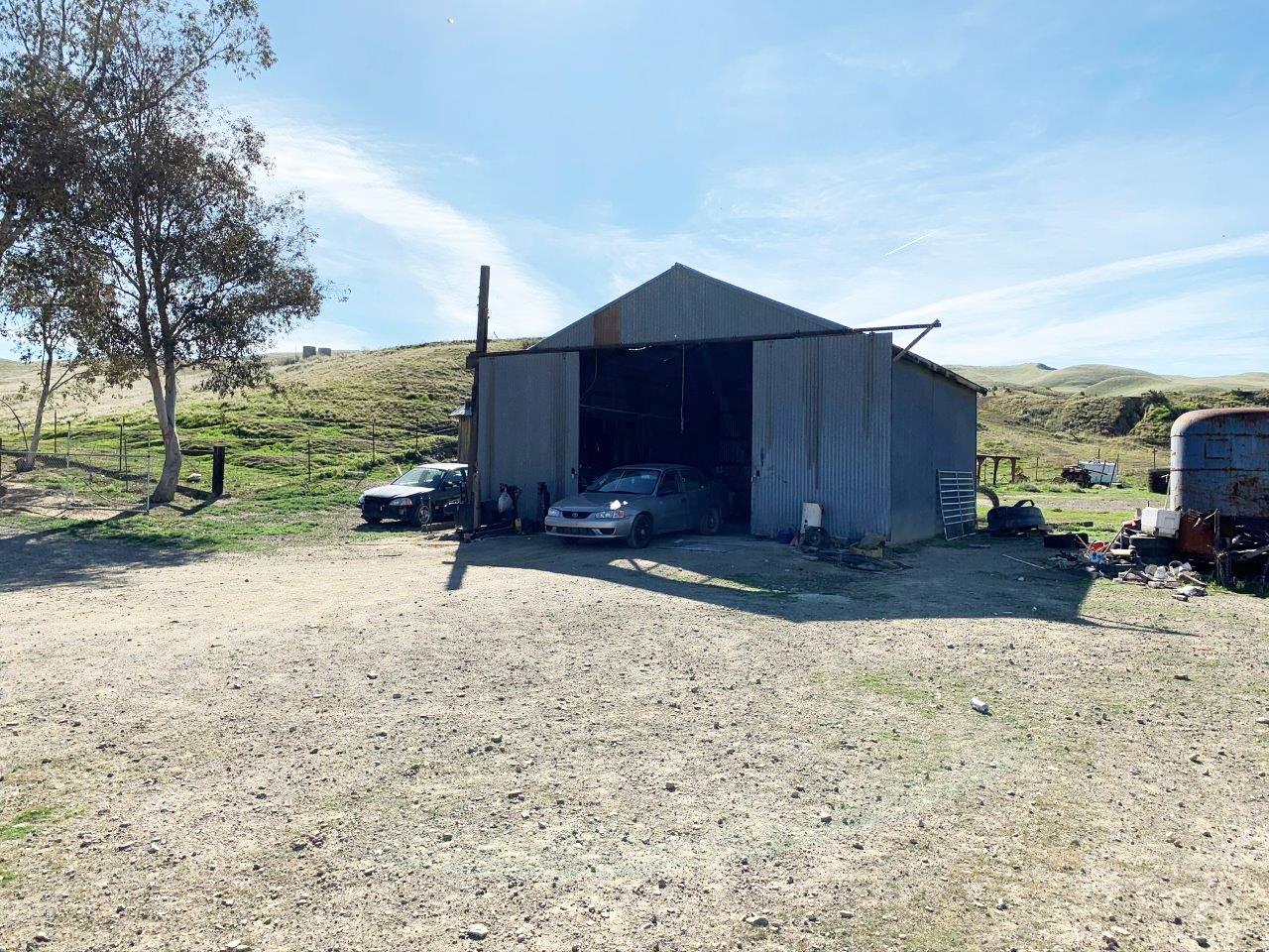 0 Little Panoche Road Firebaugh, CA 93622 - Photo 58 of 65 a view of a back yard with a wooden fence