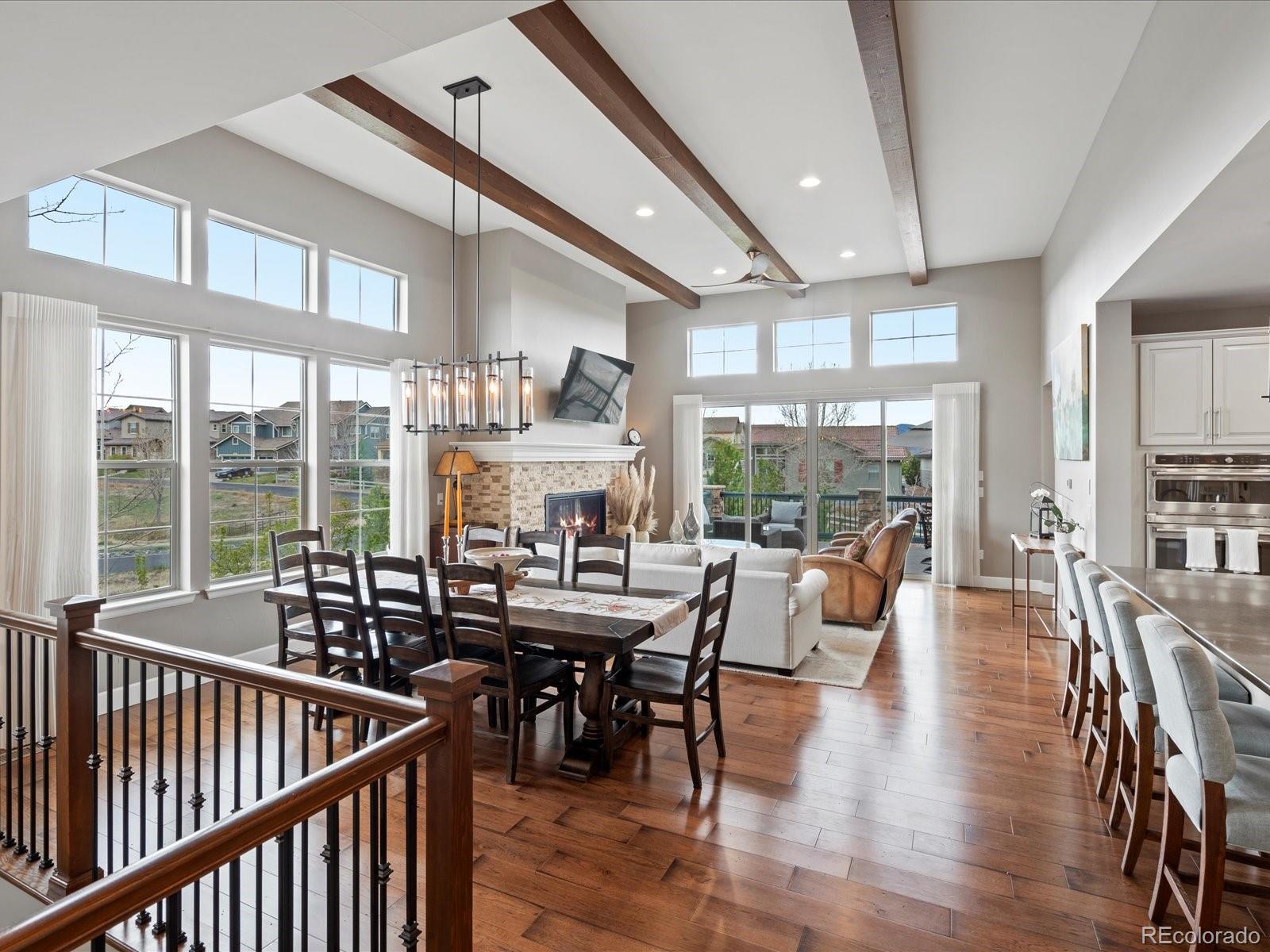 10553 Fairhurst Way Highlands Ranch, CO 80126 - Photo 12 of 35 a view of a dining room with furniture window and wooden floor