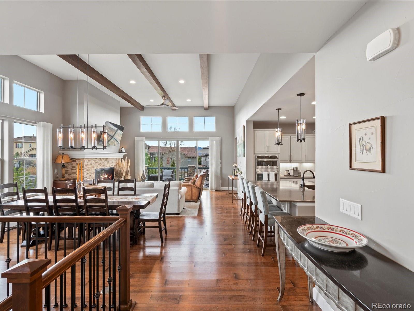 10553 Fairhurst Way Highlands Ranch, CO 80126 - Photo 13 of 35 a view of a dining room with furniture window and wooden floor