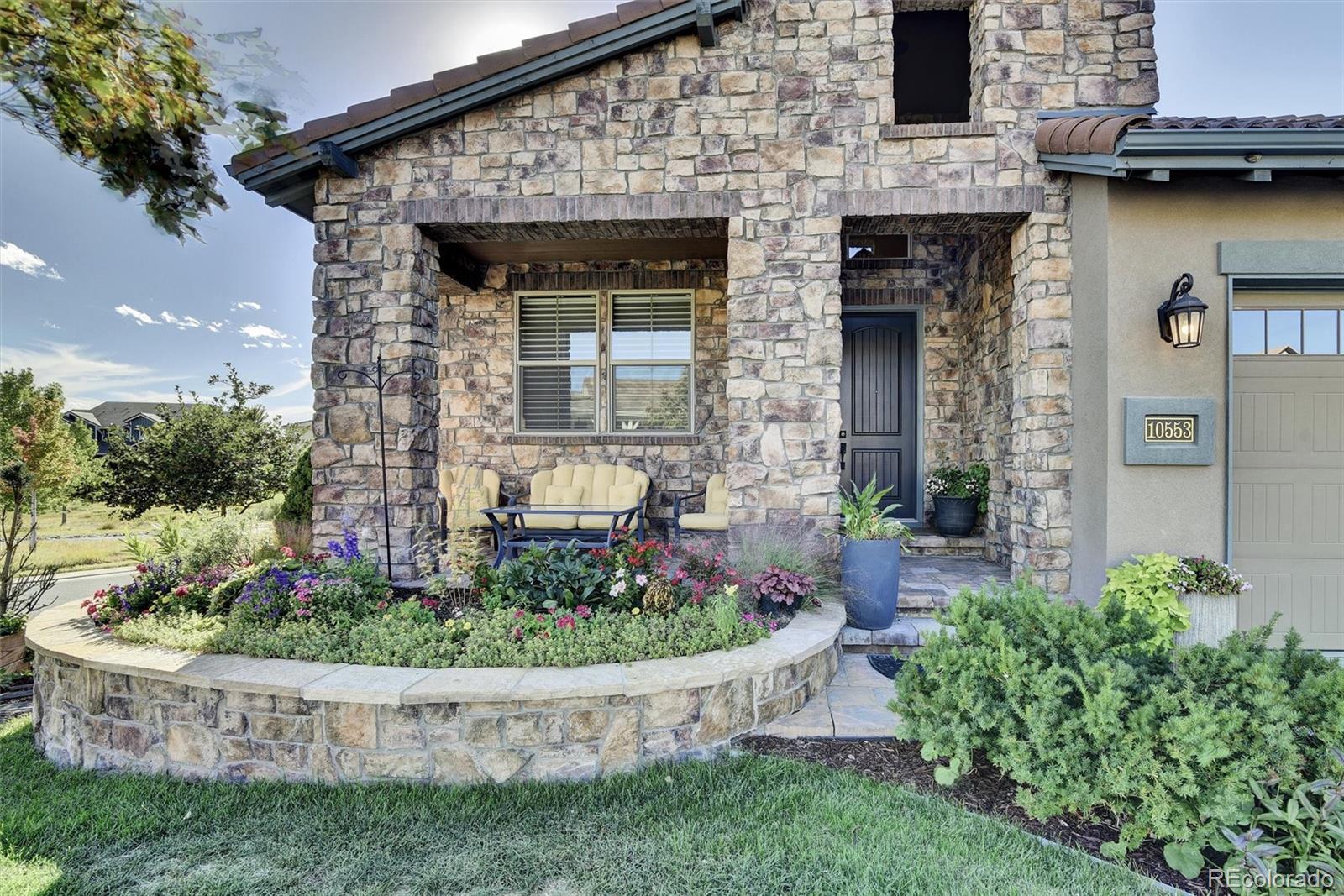 10553 Fairhurst Way Highlands Ranch, CO 80126 - Photo 2 of 35 a front view of a house with a yard
