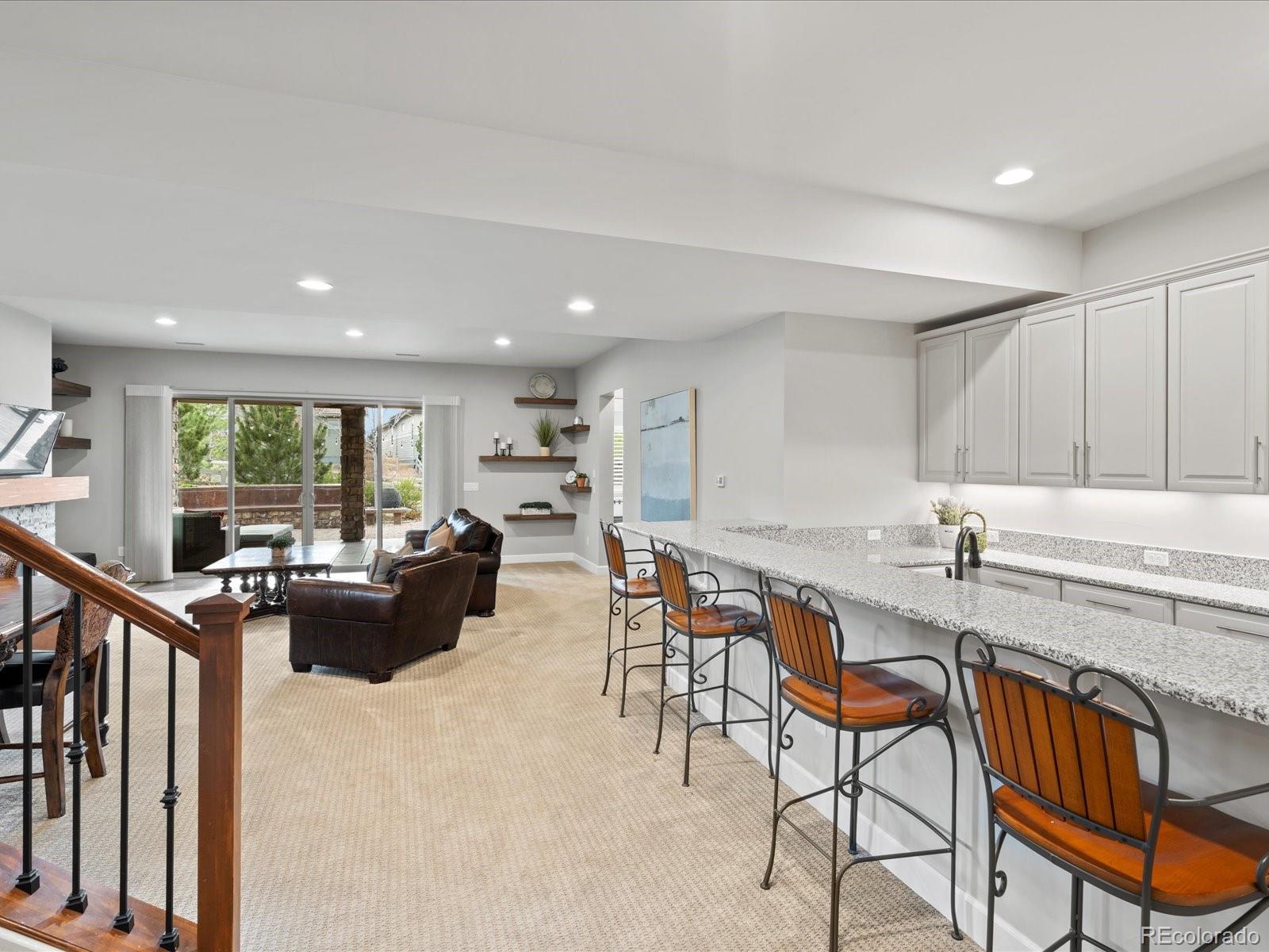 10553 Fairhurst Way Highlands Ranch, CO 80126 - Photo 24 of 35 a view of a dining room kitchen with furniture and a window