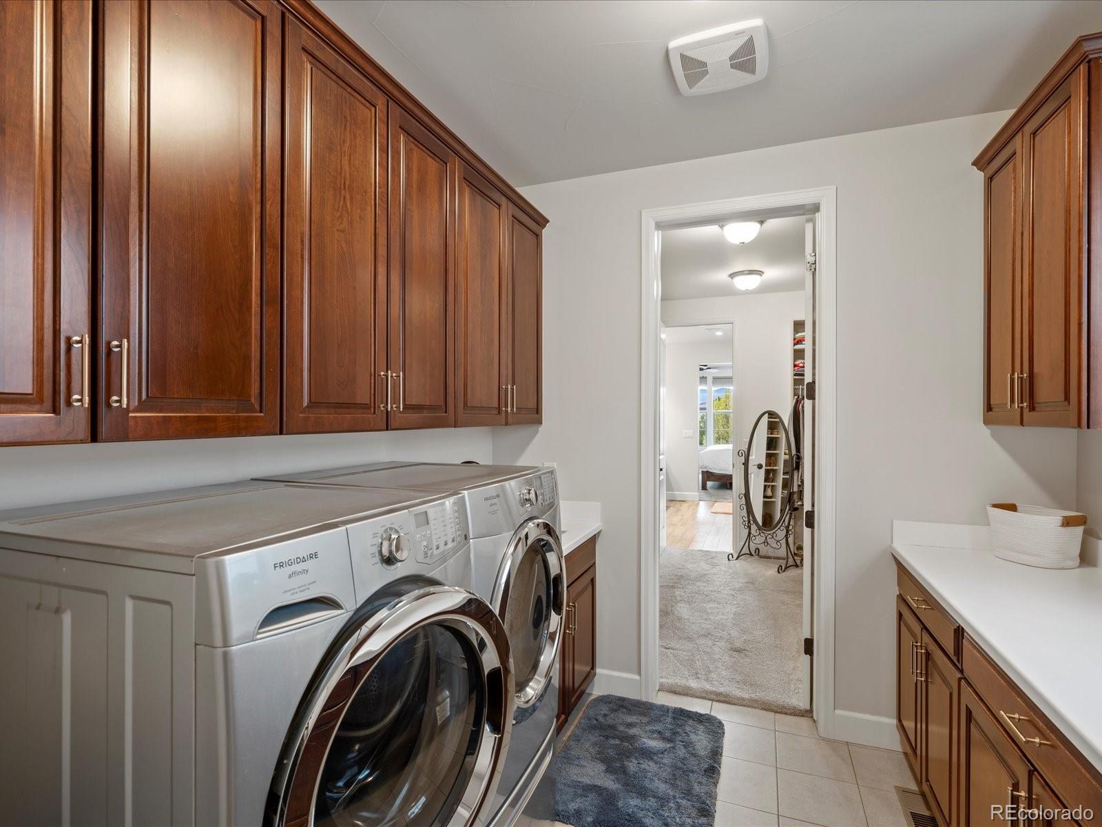 10553 Fairhurst Way Highlands Ranch, CO 80126 - Photo 30 of 35 a view of a hallway with washer and dryer