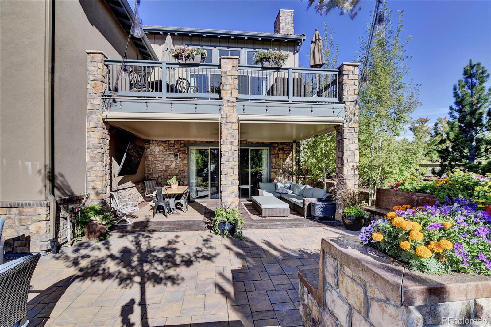 10553 Fairhurst Way Highlands Ranch, CO 80126 - Photo 5 of 35 a view of a chairs and table in a patio