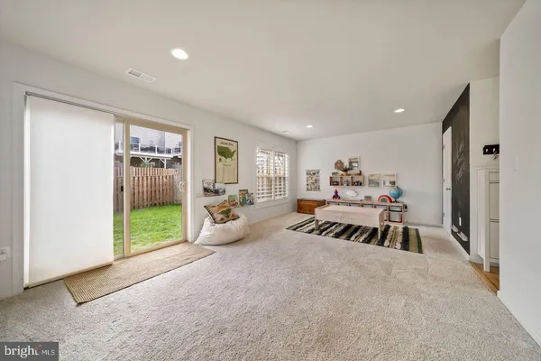a bed room with furniture and a window