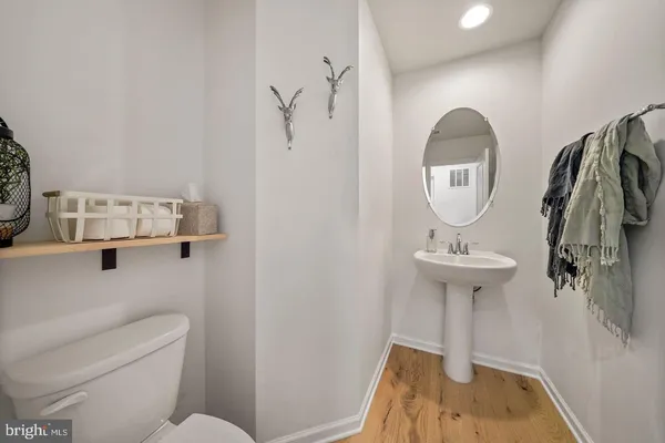 a bathroom with a sink toilet and tub