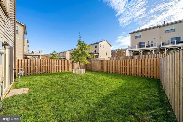 a view of a house with backyard and porch