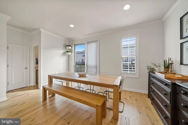 a view of a room with furniture and wooden floor