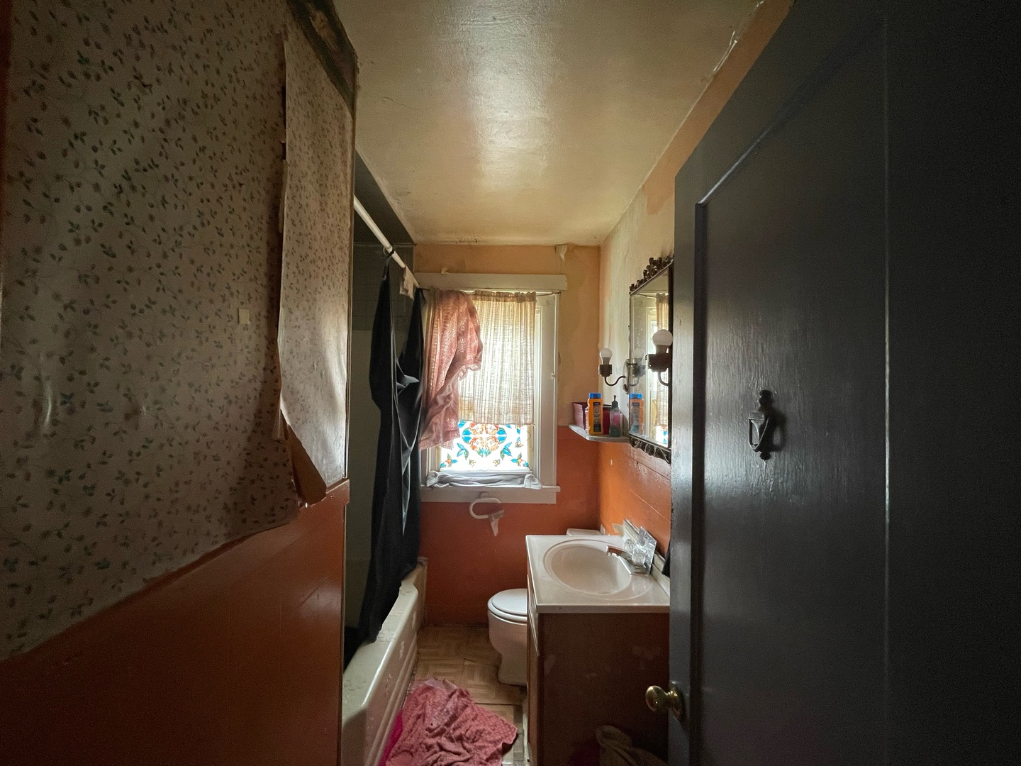 1536 East Division Street Decatur, IL 62526 - Photo 9 of 13 a bathroom with a sink a mirror and a shower